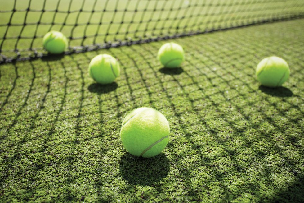 Tennis balls on the court grass