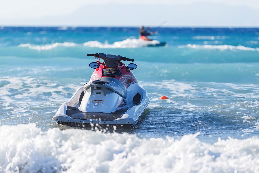 Blue sea and a jet ski floating on the ,