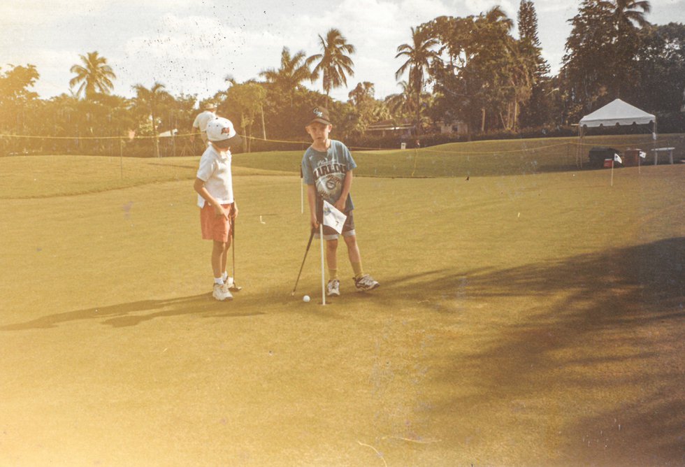 25. Rhys + neighbor playin golf torunament