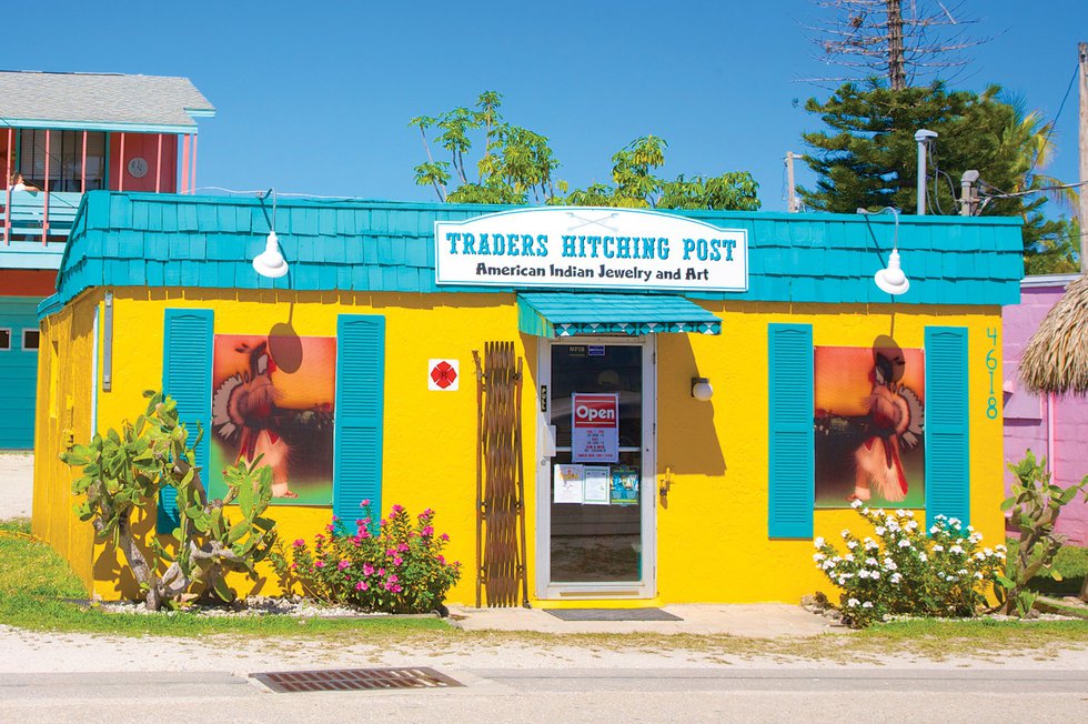 View from the road of a multi-colored small business in Matlacha