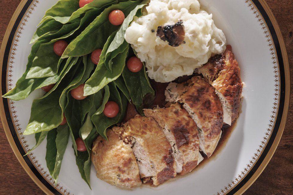 Meat dish with side salad and mash potatoes