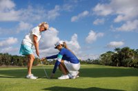 Katie teaching golf