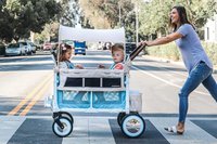 Woman pushing children in a stroller