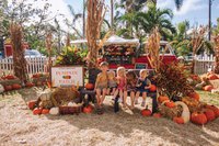 Kids posing at a pumpkin patch