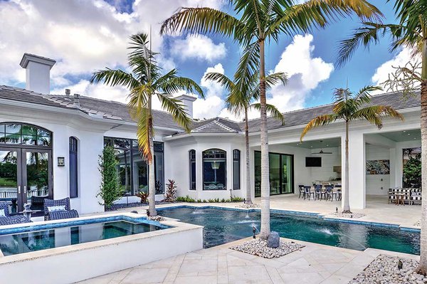 Lanai with pool and palm trees.jpg