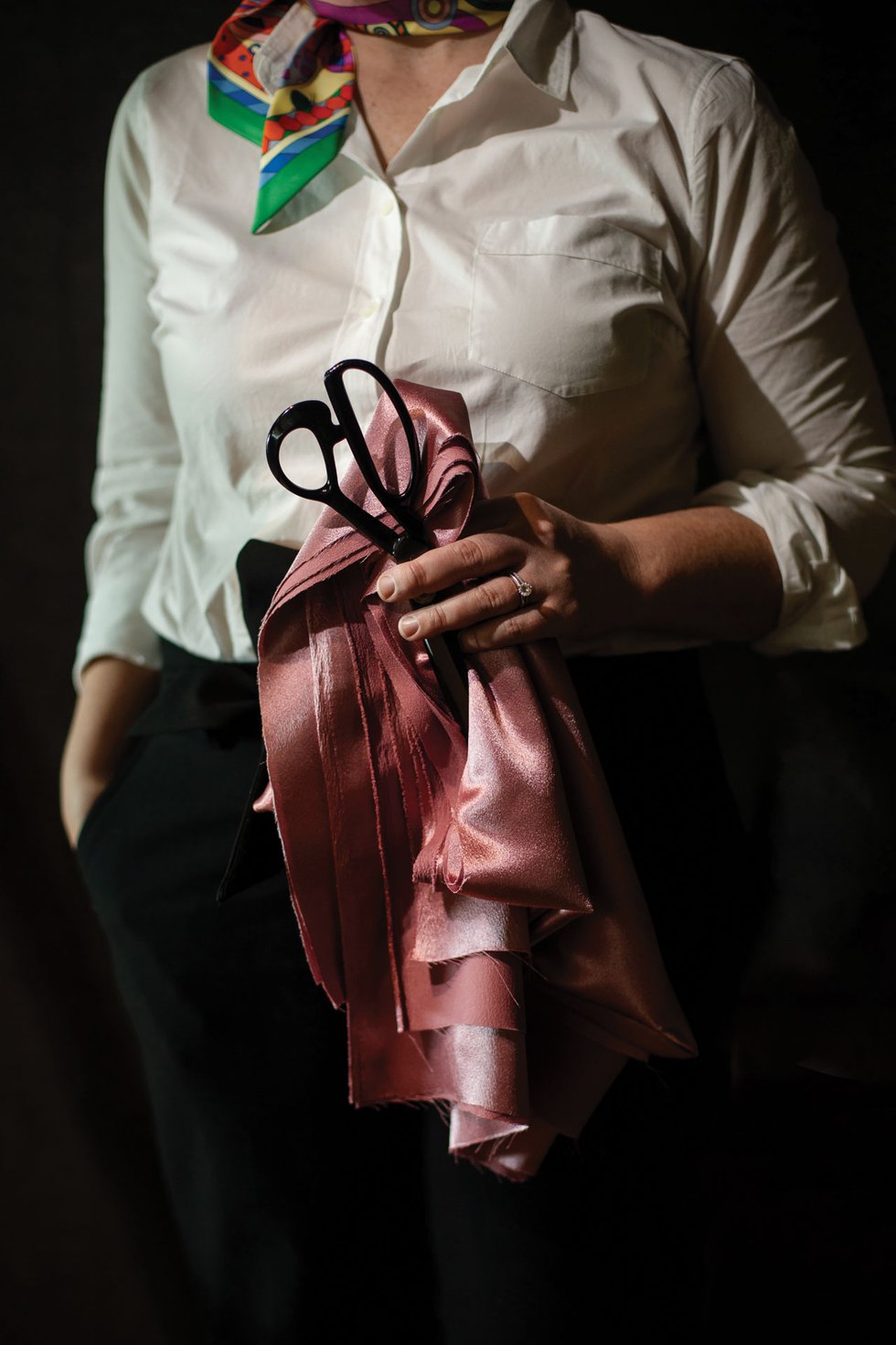 Woman holding fabric and scissors