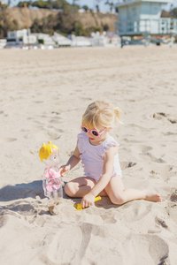 girl playing with sand toys