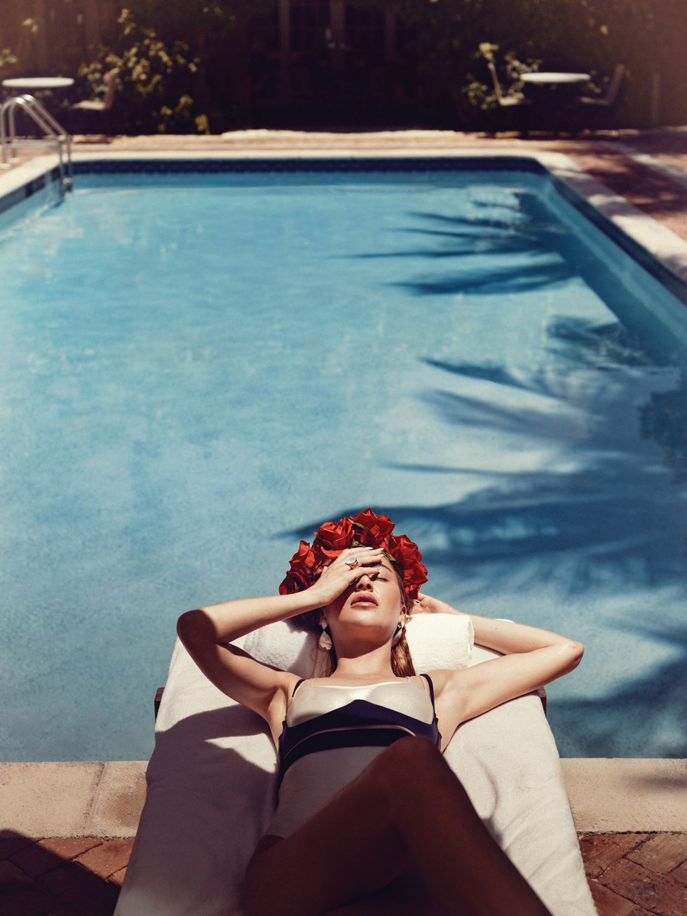 Hotel Escalante by the pool model laying on diving board.jpg