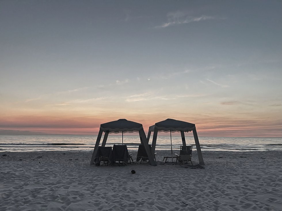 Cabana setup on Naples beach at sunset