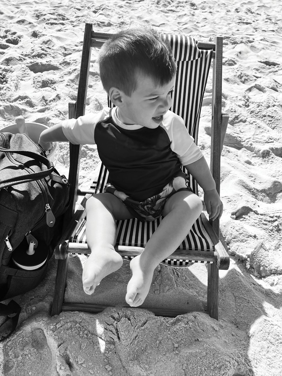 little boy enjoying the beach and chair setup