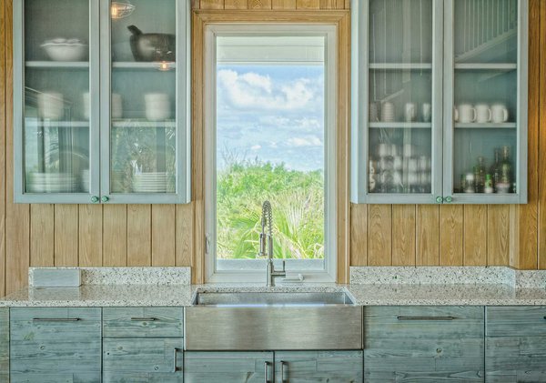 Wooden interior kitchen with blue cabinetry.jpeg