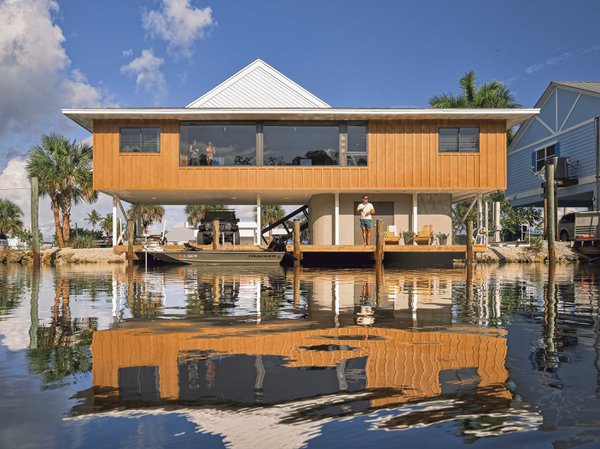 Lifted home overlooking the canal with dock.jpeg