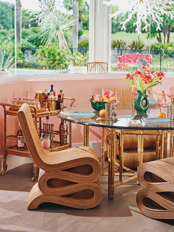 Glass kitchen table with bamboo chairs.jpeg