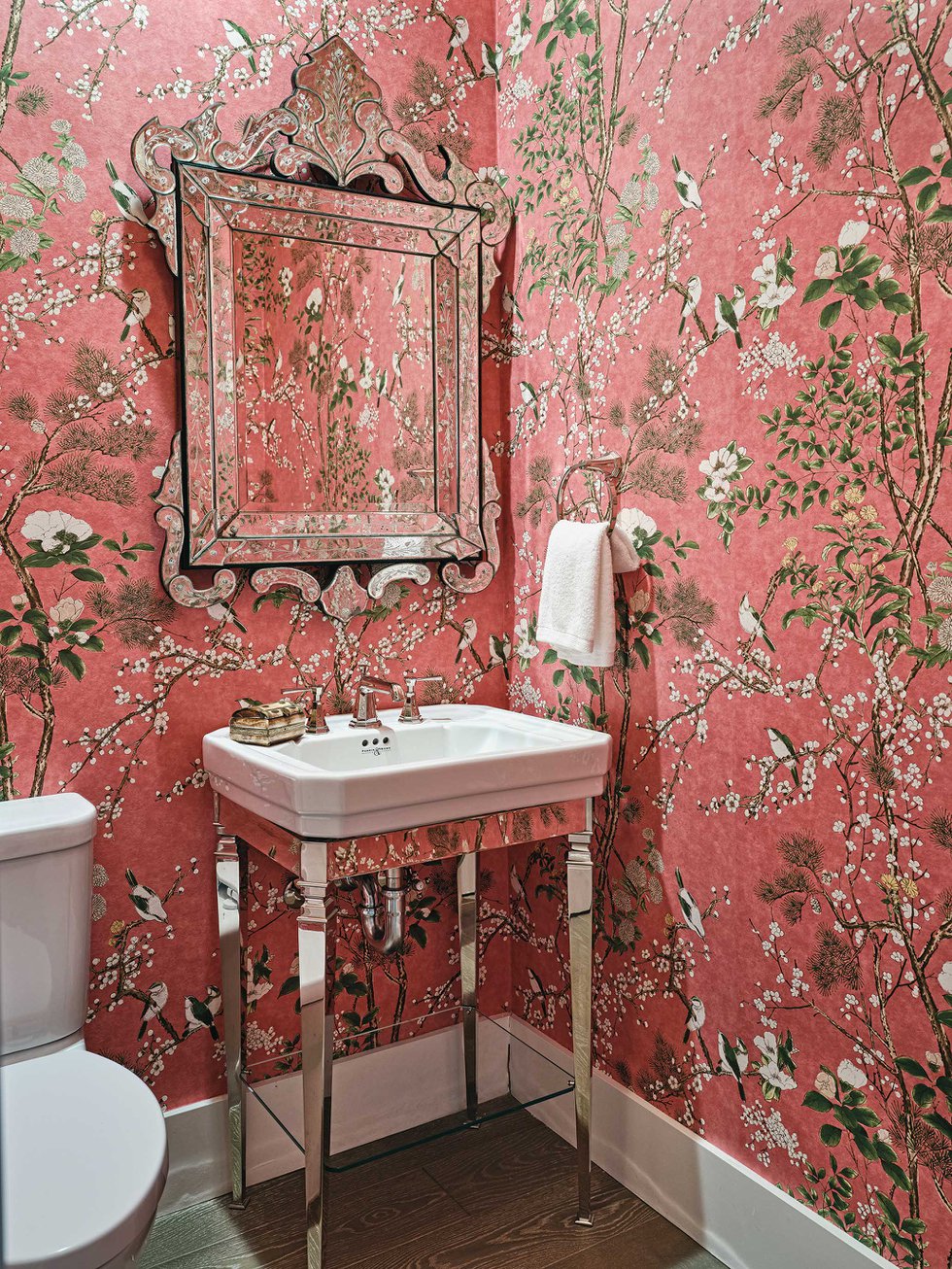 Bathroom vanity with pink wallpaper.jpeg