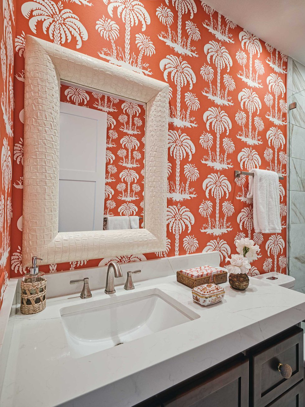 Bathroom vanity with coral and white palm wallpaper.jpeg