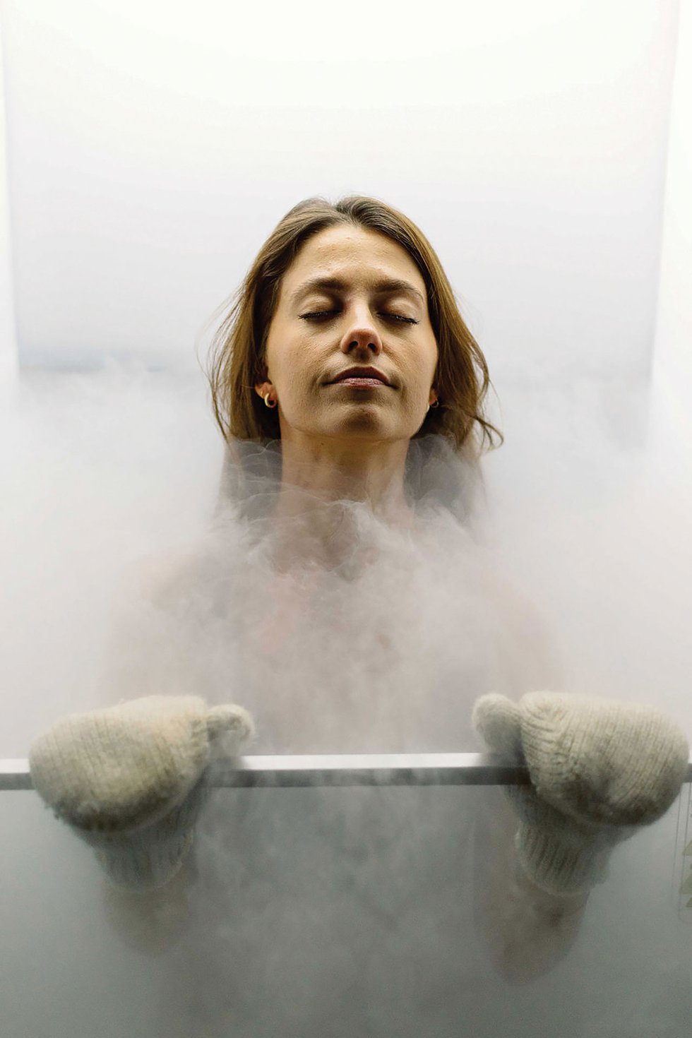 Woman in cryotherapy chamber