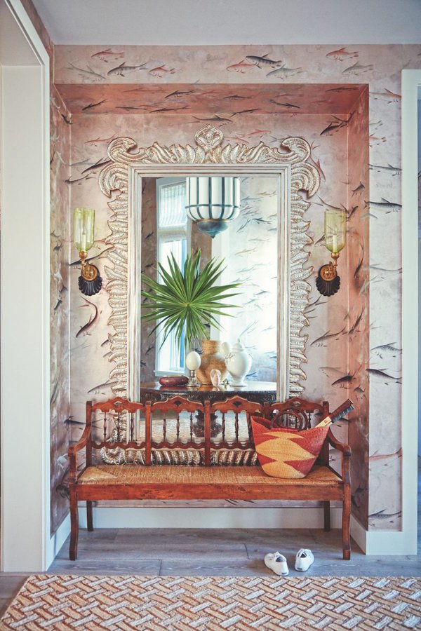 Bench and mirror with pink wall and intricate designs.jpg