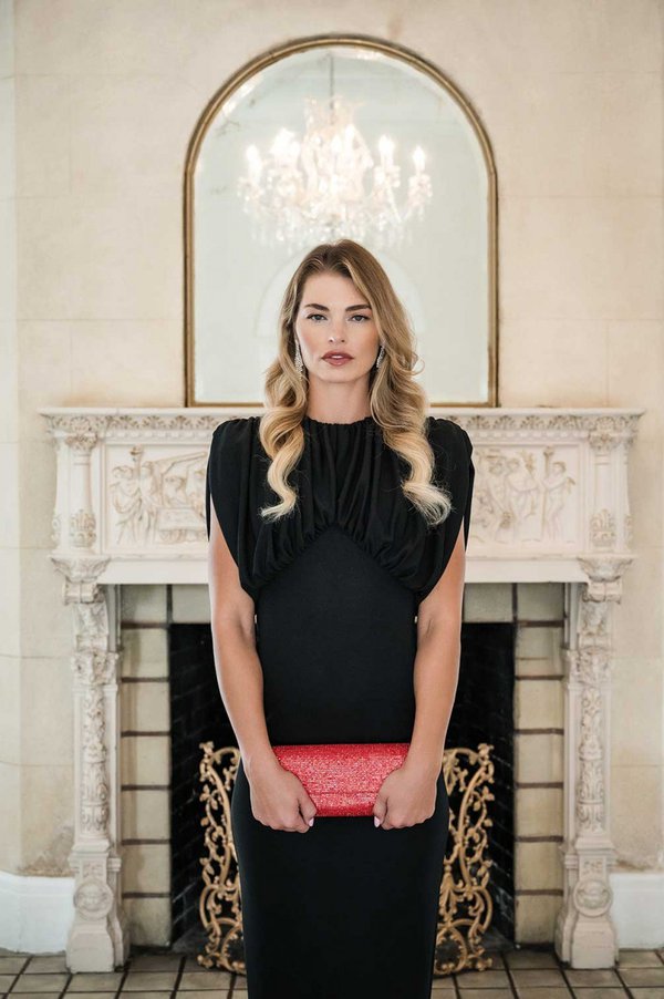 Model in black dress with red purse.jpg