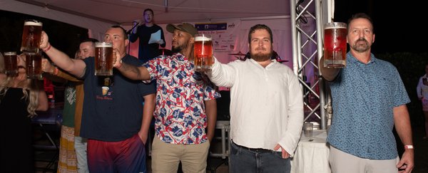 four men enjoying festival