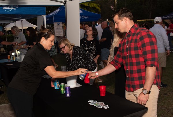 man being served beer