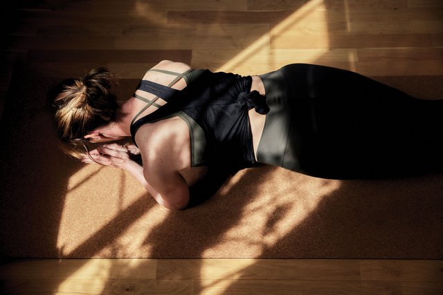 woman holding a plank yoga position