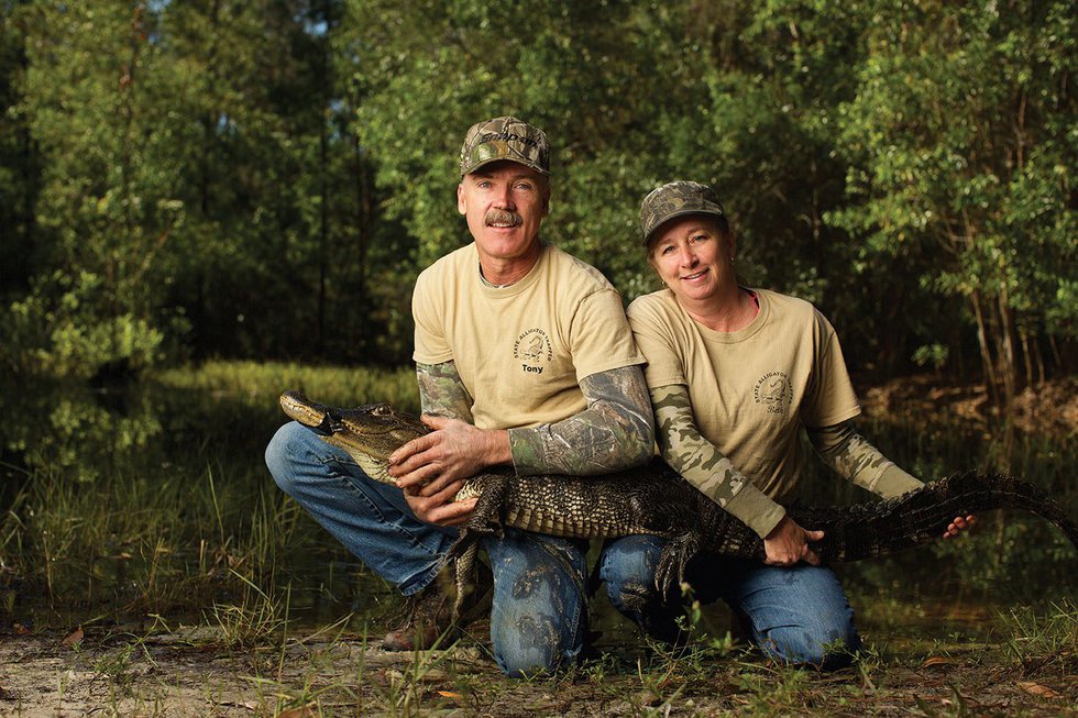 Tony and Beth Hamm, of Naples, with a 6&#x27; alligator. with Photo by Brian Tietz